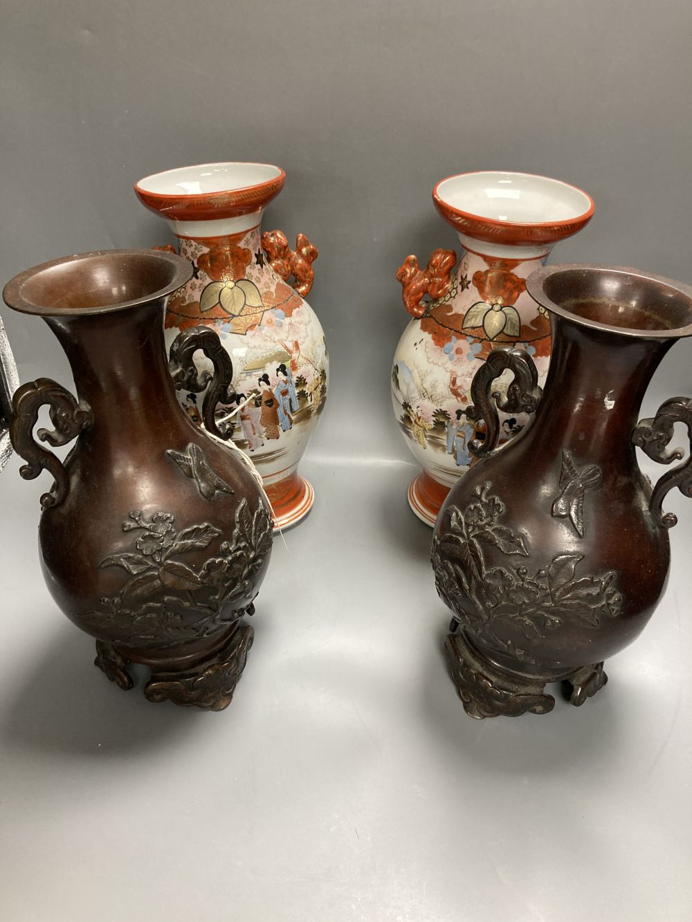 A pair of Japanese two handled bronzed vases and a pair of Japanese Kutani vases, tallest 37cm